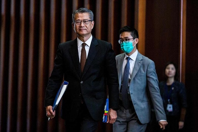 Hong Kong Financial Secretary Paul Chan arriving to deliver the annual budget at the Legislative Council in Hong Kong on Wednesday.