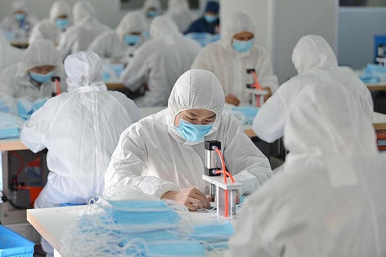 Workers making face masks last week at a factory in Nanjing, Jiangsu province, that normally makes surgical instruments and dental equipment. It is among companies in China that have revamped part of their production facilities to make masks in order