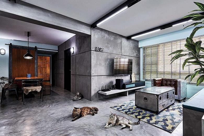 A bespoke built-in concrete settee (above) complements the industrial-chic vibe of the home. 