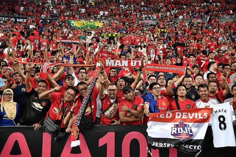 Manchester United fans packing the National Stadium last July to witness their team beat Inter Milan 1-0 in the International Champions Cup. They were part of a record 52,897 crowd. ST FILE PHOTO
