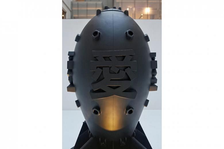 The monochromatic installation Love Bomb (above) features a replica of an atomic bomb labelled with the Chinese character for love. It signifies the duality of human creativity and destruction, while conveying Phunk’s belief that love is the most powerful