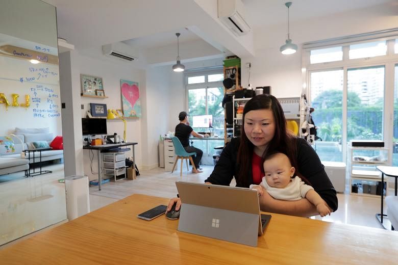 Ms Beatrice Liu-Cheng, who works out of her Balestier apartment, sometimes accompanied by her husband Nicholas Cheng (in the background), while watching over six-month-old Liam