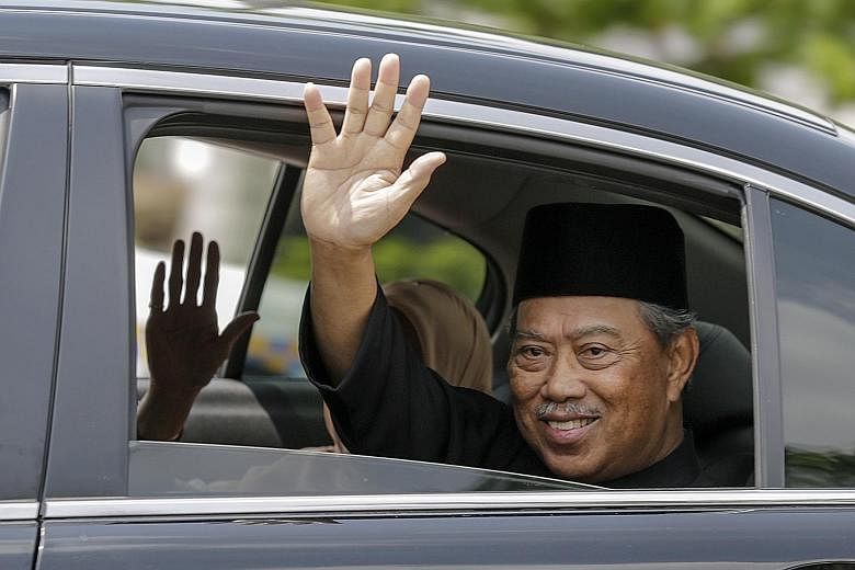 Malaysia's Prime Minister Muhyiddin Yassin waving after his inauguration ceremony on Sunday. Both Umno and Parti Islam SeMalaysia, two major blocs of the coalition government, have openly voiced that Cabinet appointments would be left to Tan Sri Muhy