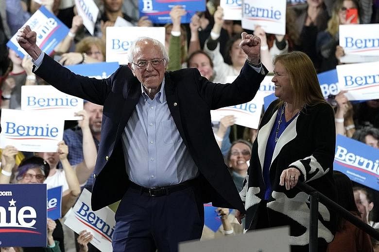 A jubilant Mr Bernie Sanders arriving for a rally in Essex Junction, Vermont, on Super Tuesday. PHOTO: AGENCE FRANCE-PRESSE Democratic presidential hopeful and former US vice-president Joe Biden taking a selfie with supporters after addressing a Supe