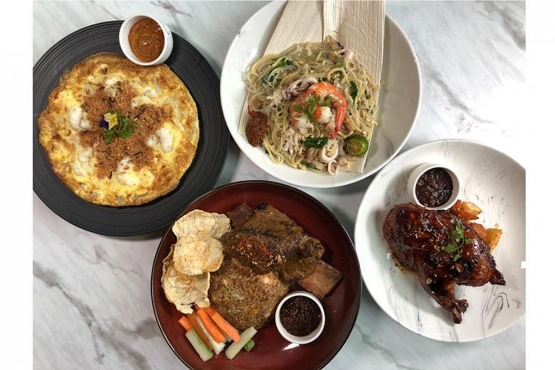 Route 65's (clockwise from top left) Cheesy Lobster Carrot Cake, Signature Hokkien Mee, Grilled Half-spring Chicken Panggang and Superstar Beef Rendang. Swee Heng Bakery's offerings include buns and Swiss rolls.