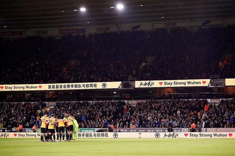 A message of support for Wuhan last month at Molineux Stadium before the Premier League game between Wolves, who are owned by Chinese investment group Fosun, and Leicester. Wuhan is the epicentre of the coronavirus outbreak. PHOTO: REUTERS