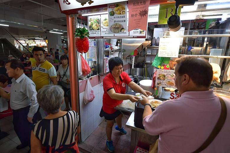 Madam Connie Chan, who runs a chicken rice stall at Chinatown Complex Food Centre, says businesses in the area have been badly affected as tourist numbers have fallen following travel restrictions, while locals have kept away out of fear of crowded a