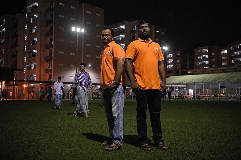 Two of the 5,000 foreign worker ambassadors are Bangladeshi Shafikul Islam (left) and Indian national K. Deivasigamani, who disseminate accurate information, such as government advisories, in a timely manner to WhatsApp groups that include their coll