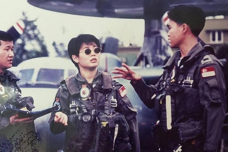 Ms Doris Ng in her earlier days (above) in the Republic of Singapore Air Force, where she was the first woman selected to join the aircrew of the E-2C Hawkeye aircraft. Ms Ng (left), who later joined the Singapore Prison Service, is now executive dir