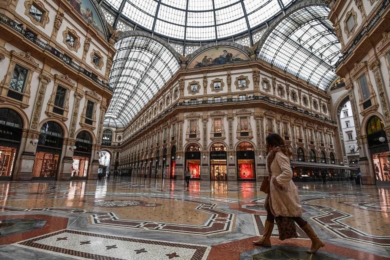 Rome's Spanish Steps left virtually deserted as the nationwide clampdown took effect yesterday. Other landmarks were also closed or empty. A near-empty shopping mall yesterday in Italy's financial capital Milan, which is already under stricter contro