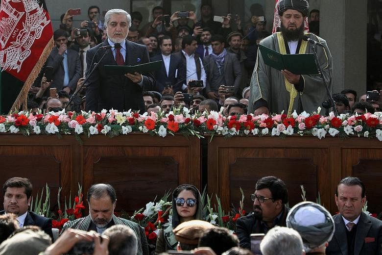 Mr Abdullah Abdullah swore himself in as Afghan premier on Monday, in a move denounced by the US.