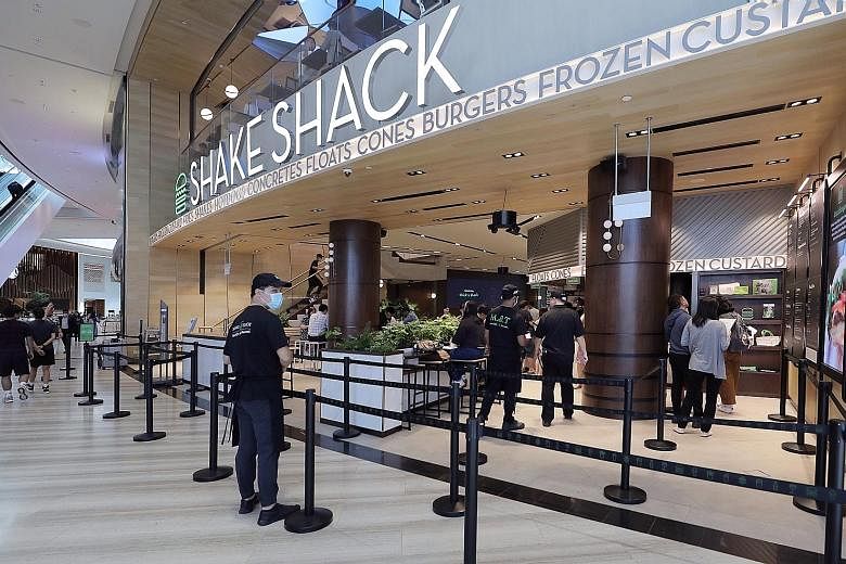 The near-empty queueing area at the Shake Shack burger outlet at Jewel Changi Airport last month. Fears about the coronavirus outbreak have prompted many people to stay away from crowded public places, and food businesses have taken a huge hit. Econo