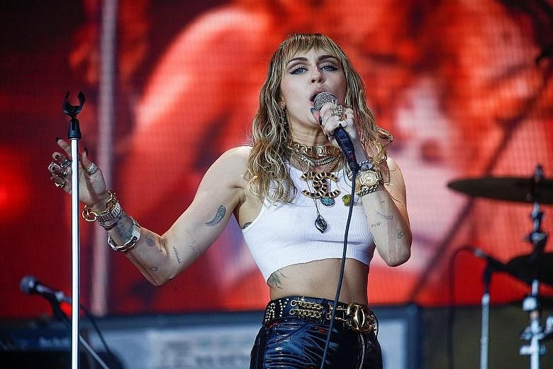 Pop star Madonna (right) has called off two concerts in Paris, France, while fellow singer Miley Cyrus (below right) has cancelled a trip to Melbourne, Australia, where she was to perform at a bush-fire relief concert tomorrow.