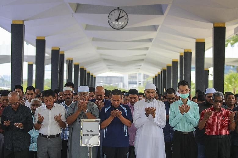 Muslims at a prayer session at the National Mosque in Kuala Lumpur last Friday. Malaysia saw its biggest single-day jump in coronavirus cases yesterday, with 41 new cases, including 37 from the mosque cluster.