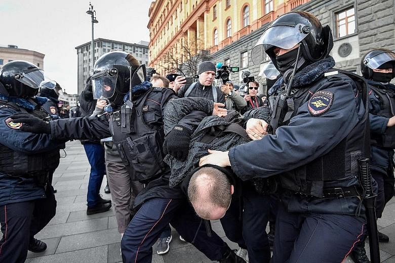 Riot police detaining a participant of an unsanctioned rally in front of the FSB security services headquarters in central Moscow last Saturday. The protesters were demanding the release of political prisoners.