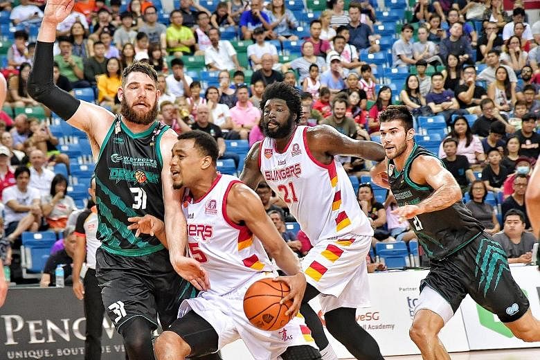 Slingers import players like Xavier Alexander (second from left), Anthony McClain (No. 21) and Jameel McKay (above) will return to the United States at the end of this month following the indefinite suspension of the ABL.