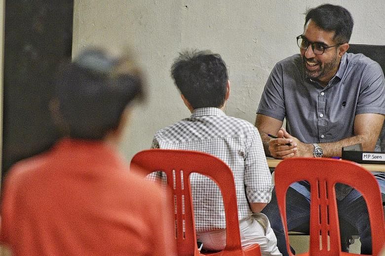 Workers' Party chief Pritam Singh, an MP for Aljunied GRC, at his Meet-the-People Session in Bedok Reservoir Road yesterday. He said the party will continue with house visits, but has limited the number of people at such visits and during other activ