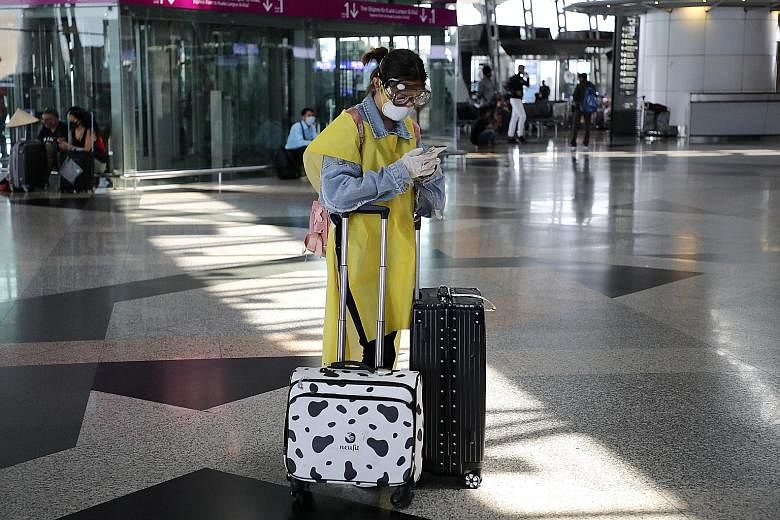 A well-protected traveller in a nearly empty Kuala Lumpur International Airport yesterday, the last day for Malaysians to leave the country, and for foreigners to enter before a restricted movement order that begins today.