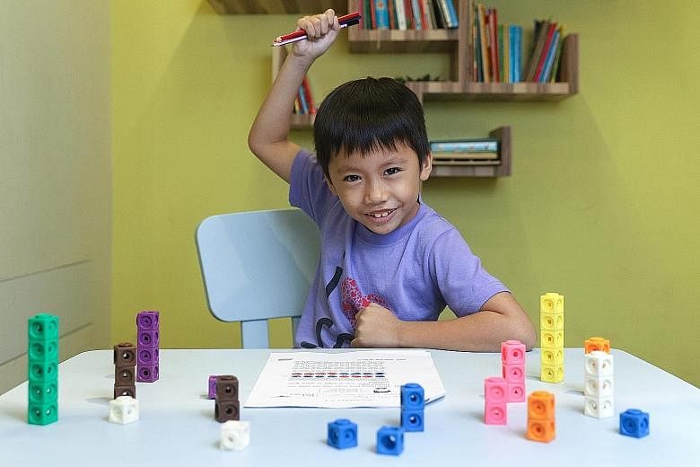 Kenneth Chow, six, could barely speak English when he arrived in Singapore two years ago from Indonesia, but is now fluent in the language, thanks to a programme by ReadAble. The volunteer group is part of national scheme ComLink, which provides proa