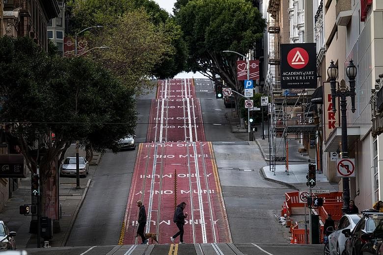 San Francisco's Powell Street, usually busy with traffic and the city's famed cable cars, was largely deserted on Tuesday. There are fears that the US, with more than 7,000 confirmed cases and over 110 deaths yesterday, is heading the way of Italy, w