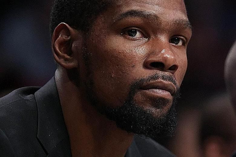 Kevin Durant, one of four Nets players to test positive, has yet to play this season because of an Achilles tendon injury.