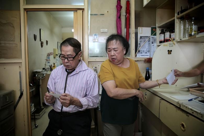 Dr Chan Khye Meng and receptionist Doreen Tan at Meng's Clinic in Tanglin Halt on June 21, 2019, before the doctor's retirement. The upcoming museum will feature Meng's Clinic's beige wooden benches, its red and white signboard and the doctor's name 