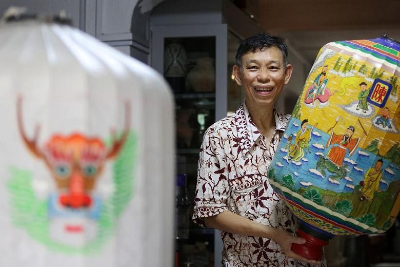 Mr Jimm Wong with a completed lantern he crafted. A heritage enthusiast with a keen interest in Chinese history and culture, he has been making lanterns since 2008. ST PHOTO: JOEL CHAN
