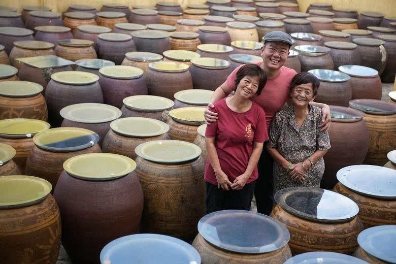 From left: Madam Tan Poh Choo, 63, a sauce master; Mr Ken Koh, 36; and Madam Ng Soh Lian, 94. The family-run Nanyang Sauce Factory, which has roots dating back to 1959, continues to pursue and uphold authentic soya sauce making traditions. Madam Ng, 