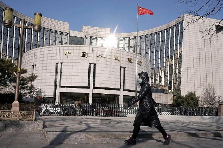 The headquarters of the People's Bank of China in Beijing. Analysts said the surprise non-action suggests the authorities in China are broadly comfortable with the current policy settings for now after the central bank last week cut the amount of res