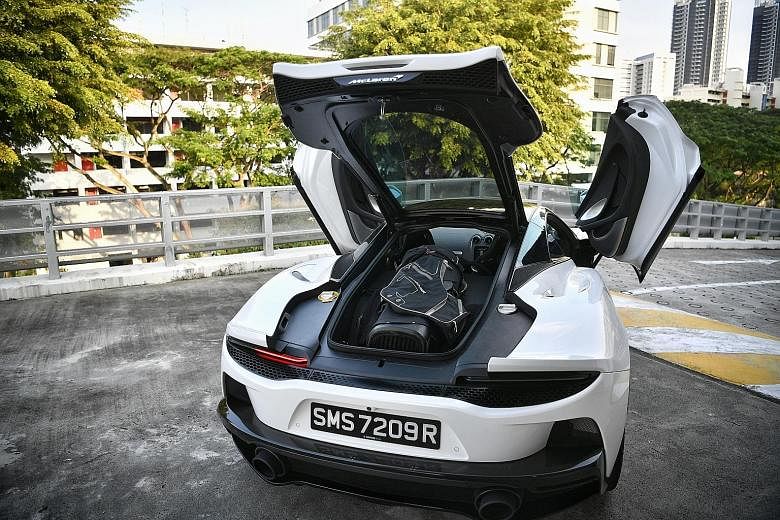 The McLaren GT is a creditable cross-country liner with a decent amount of comfort and practicality. The 4-litre twin-turbocharged V8 is placed lower on the chassis to free up more stowage area above it. The glass on the boot lid (above) is slightly 