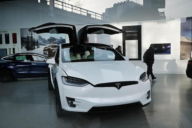 A Tesla car in a Manhattan dealership in January in New York. Tesla is expected to see a sales decline this year even with its much-anticipated Model Y crossover SUV.