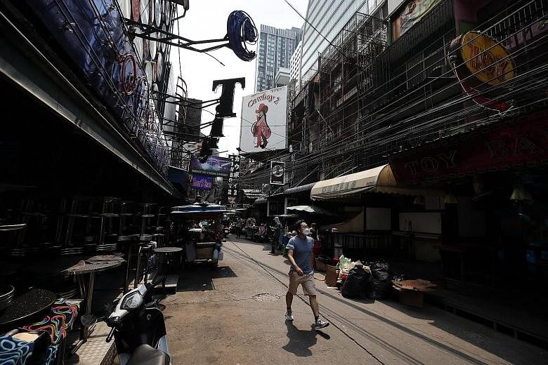 Bars and nightclubs were closed in a nearly deserted entertainment street in Bangkok yesterday, after a shutdown imposed from Wednesday.