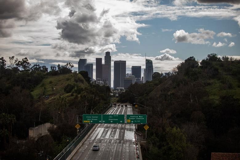 The usually jam-packed 110 Freeway in Los Angeles was virtually empty on Thursday. The statewide order to stay home will be in place until further notice, but allows residents to leave for necessary errands such as grocery runs and for essential jobs