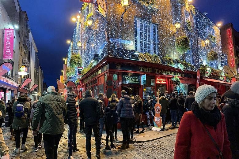Enjoy music at The Quays Bar and Restaurant in Galway and take a swig of whiskey at the Temple Bar (above) in Dublin. 