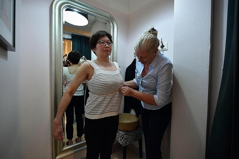Bra fitter Kate Pedersen from Change Lingerie at Cluny Court helping the writer to find the right bra fit. 