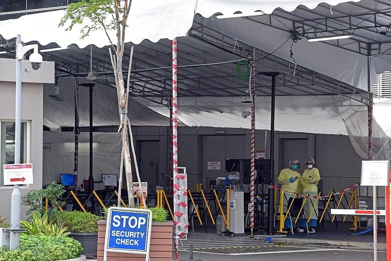 Tents set up outside the National Centre for Infectious Diseases for temperature taking and screening of patients. Singapore reported its first two deaths from the coronavirus yesterday.