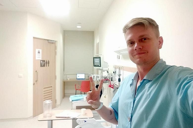 Mr Simon Gwozdz, 29, the founder of local tech start-up Equatorial Space Industries, in his isolation room at Ng Teng Fong General Hospital on Friday. He has been warded there since Monday. PHOTO: COURTESY OF SIMON GWOZDZ