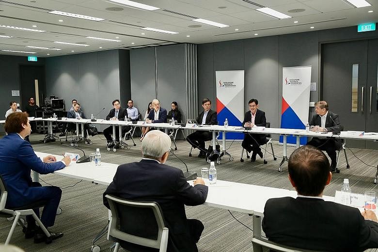 In a Facebook post on Friday, Deputy Prime Minister Heng Swee Keat (second from right, facing camera) said he and Trade and Industry Minister Chan Chun Sing had a dialogue with members of the Singapore Business Federation and trade associations to be