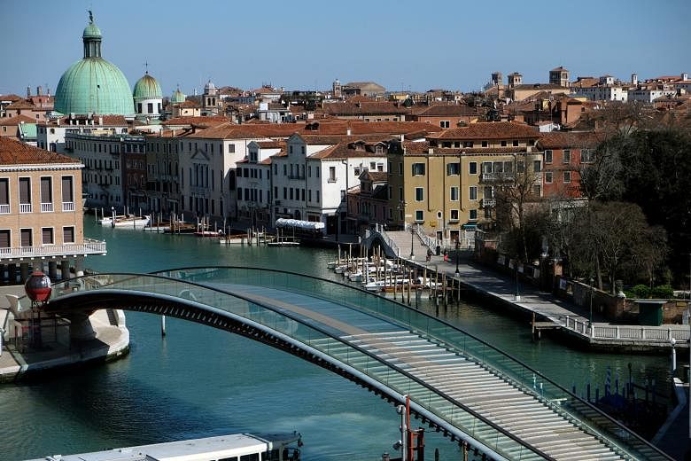 The empty Constitution Bridge on the Grand Canal in Venice last Sunday as Italy imposed a lockdown in the country to slow the spread of the coronavirus. 