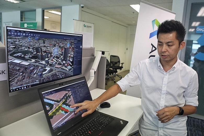 Mr Ho Kah Chun, 37, a technical sales specialist, demonstrating the information provided by Autodesk via the 3D Singapore Sandbox. He is showing how it can be used by planners to understand how certain design could affect the visibility of drivers, i