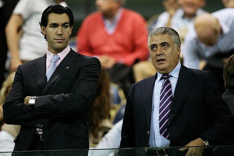 Lorenzo Sanz with his son Lorenzo Junior at a Serie A game in 2005. The elder Sanz died on Saturday, having tried to self-medicate his fever after contracting the coronavirus.