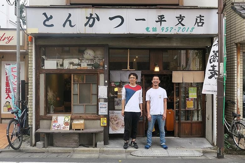 Top: The Minami-Ikebukuro Park has been spruced up to include open spaces. Above: Mr Koichi Hikamiyama (left), 43, and his employee Shota Kaneko, 29, in front of the Sheena and Ippei guesthouse in Shiinamachi district in Toshima. Children from Global