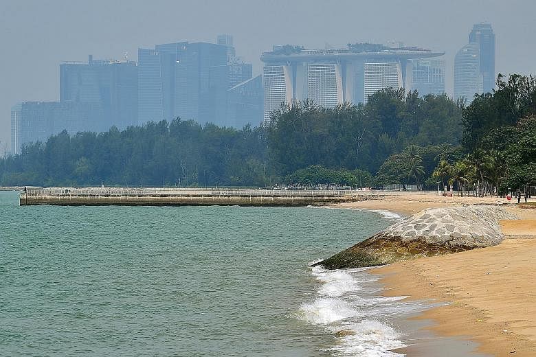 Breakwaters like the one on the right protect sandy beaches and reclaimed shores from waves and erosion. Prime Minister Lee Hsien Loong said Singapore would need to spend $100 billion over the long term to buffer its coast from the rising tides.