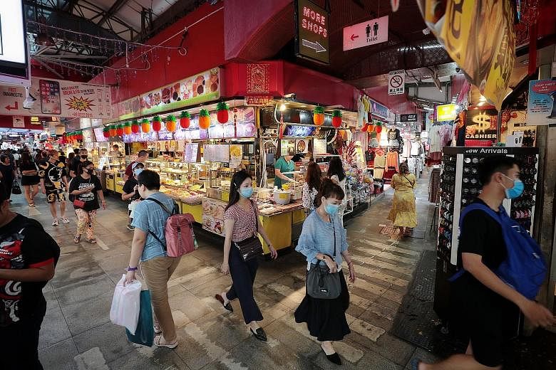 Shoppers at the Bugis street market last month. Core inflation, which excludes the costs of accommodation and private road transport, hit a decade-low when it fell sharply to -0.1 per cent year on year last month, from 0.3 per cent in January. It fel