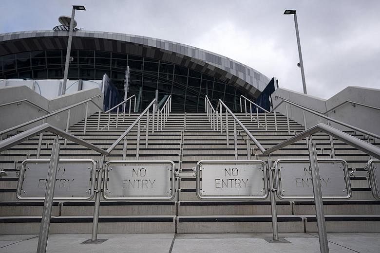 No entry signs at the Tottenham Hotspur Stadium in London. Doors may remain closed to fans, even after the Premier League restarts, if the pandemic persists.