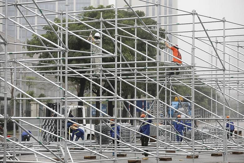 Builders uninstalling steel frames at the site of the Vietnam Grand Prix in Hanoi after the race was postponed indefinitely. It would have been the first F1 race in the country.