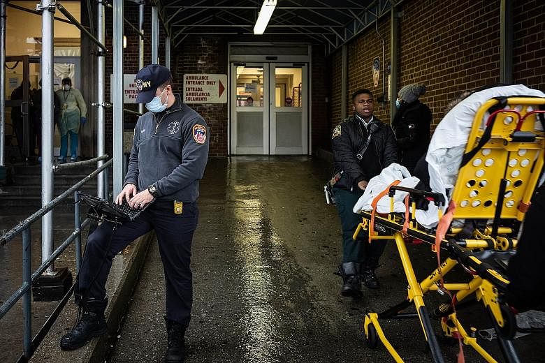 Staff working outside the emergency department at St Barnabas Hospital in New York City on Monday. The writer urges millennials to take Covid-19 seriously as their social distancing is crucial to the health of more vulnerable populations and can have