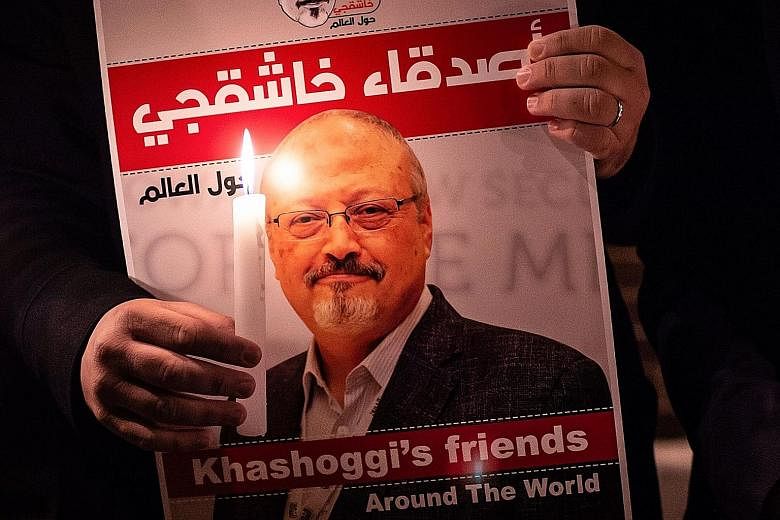 A poster of Mr Jamal Khashoggi seen at a gathering outside the Saudi consulate in Istanbul in 2018. The journalist's murder drew condemnation worldwide. PHOTO: AGENCE FRANCE-PRESSE