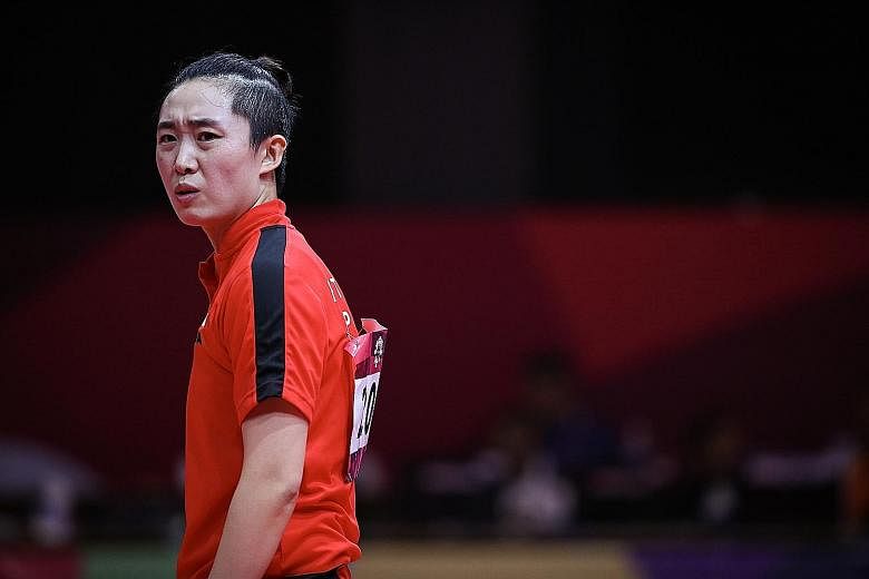 An upset Feng Tianwei during her last-16 singles loss at the 2018 Asian Games in Indonesia. She is bidding to become the oldest female table tennis Olympic medallist. ST FILE PHOTO
