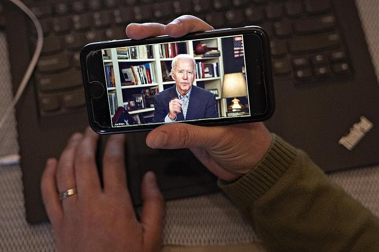 Mr Joe Biden during a virtual press briefing from his home in Wilmington, Delaware, on Wednesday. Like his rival Bernie Sanders, Mr Biden has been forced off the physical campaign trail because of the coronavirus outbreak and has to find new ways of 